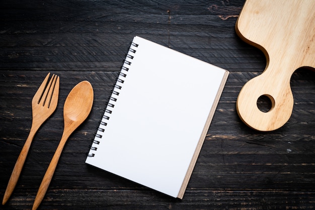 Blank notebook for text note on wooden surface with copy sapce Premium Photo