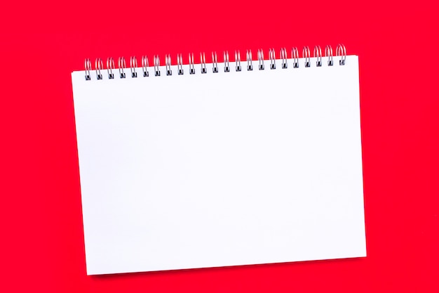 Premium Photo Blank White Notebook Sheet With A Spiral On A Plain Red Background