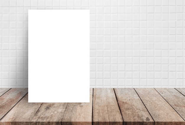 Download Premium Photo | Blank white paper poster on wood table top ...