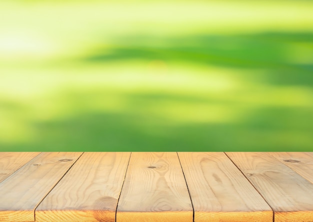 Premium Photo | Blank wood board with blur green courtyard background