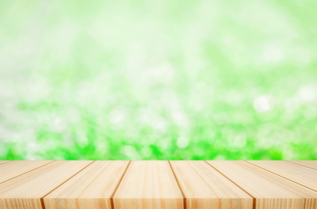 Premium Photo | Blank wooden table with blur green grass background