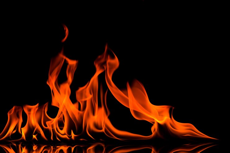 Premium Photo | Blazing fire flame on black background