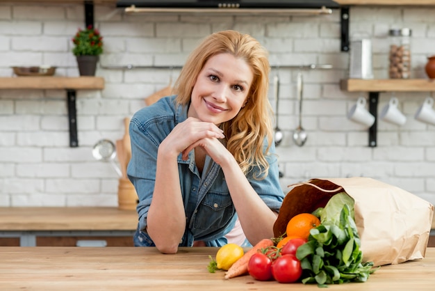 Blond woman in the kitchen Free Photo