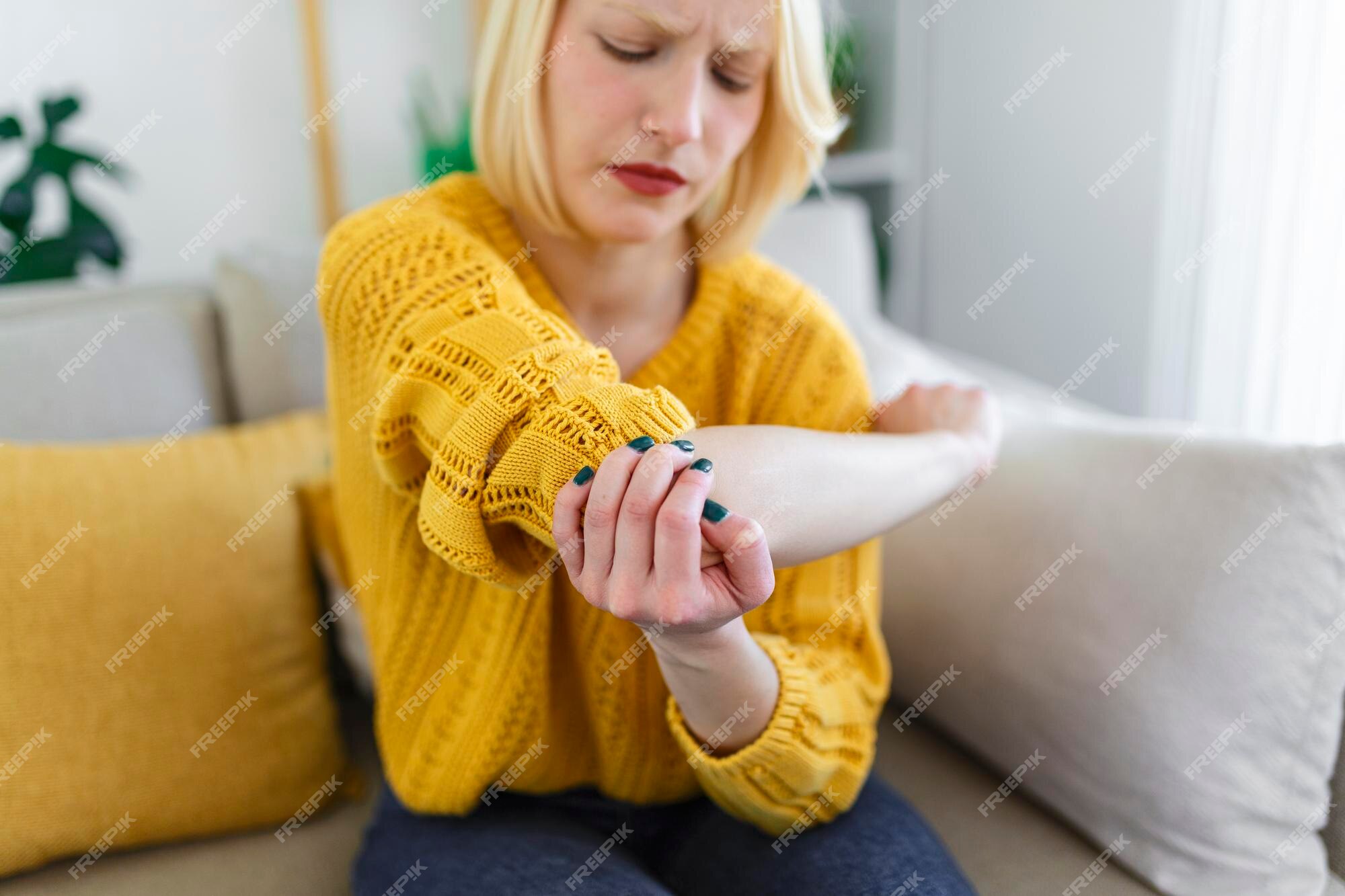 premium-photo-blond-woman-with-arm-pain-female-massaging-painful