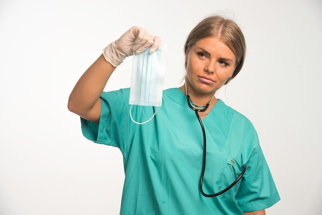 Free Photo Blonde Female Doctor In Blue Uniform With Stethoscope In