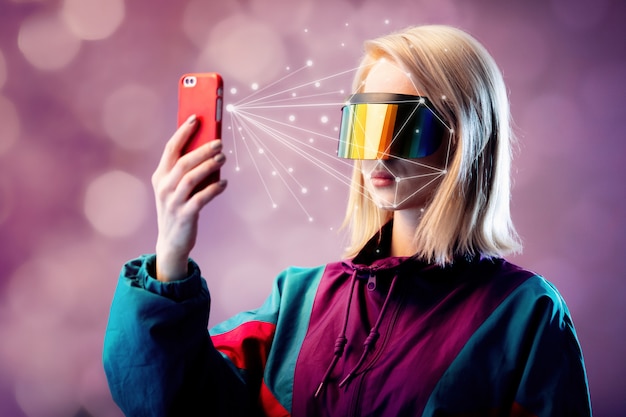 Premium Photo Blonde In Vr Glasses Hold Mobile Phone With Face Scanning Algorithm