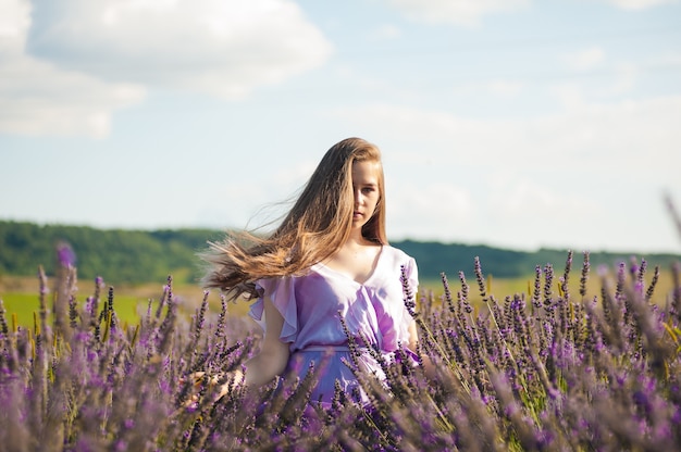 Premium Photo | Blonde woman on the garden field in the summer