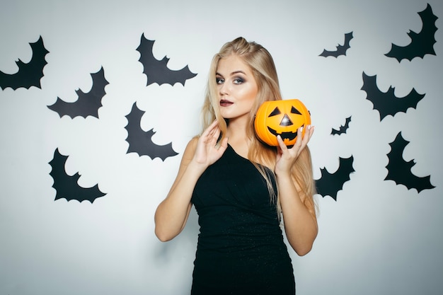 Free Photo | Blonde woman with halloween pumpkin