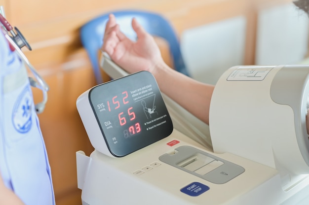 Blood pressure gauge show hypertension or high blood pressure checking blood pressure of the patient in hospital, selective focus Premium Photo