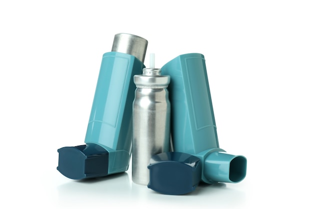 Premium Photo | Blue asthma inhalers isolated on white background