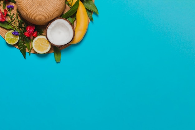 Blue Background With Fruit Decoration And Hat Free Photo