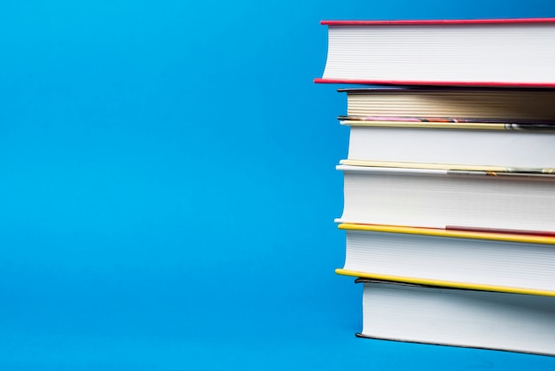 Blue background with six books and blank space Photo | Free Download