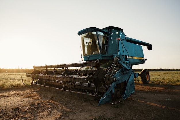 Premium Photo | Blue combine harvester agriculture machine harvesting ...