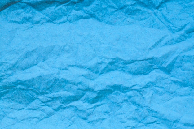 Premium Photo | Blue crumpled paper background.