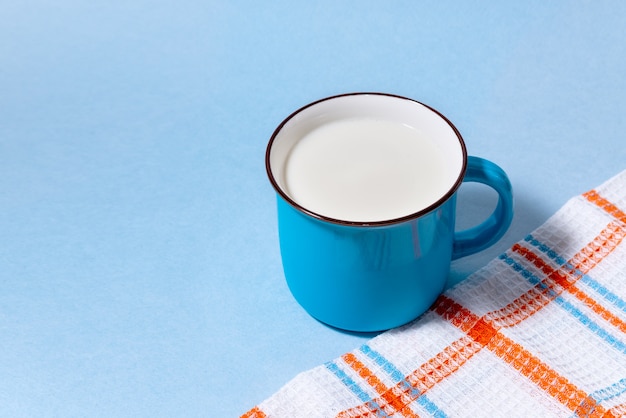 Premium Photo Blue Cup Of Milk And Checkered Towel