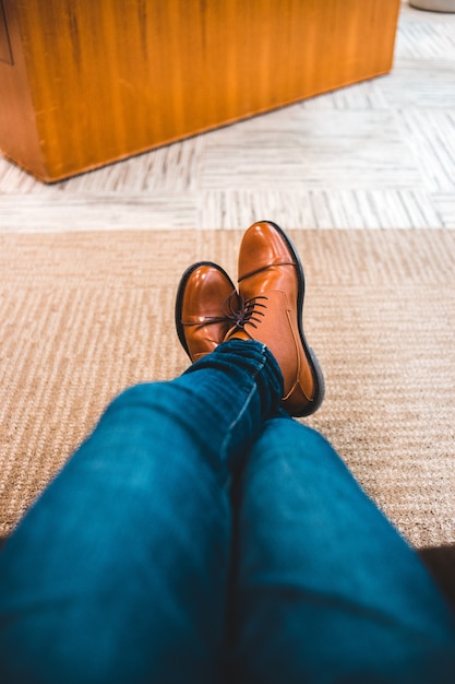 Free Photo | Blue denim jeans and brown leather shoes