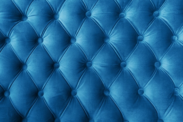 Premium Photo | Blue fabric sofa texture with buttons