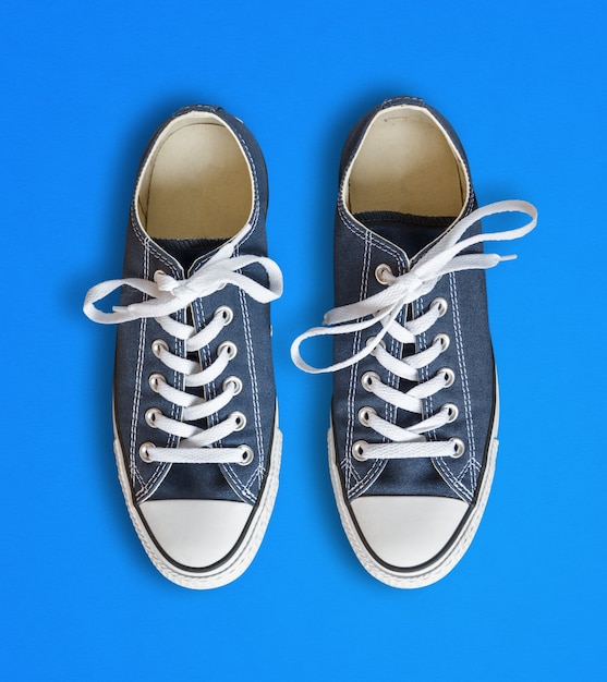 Premium Photo | Blue generic sneakers isolated on cyan