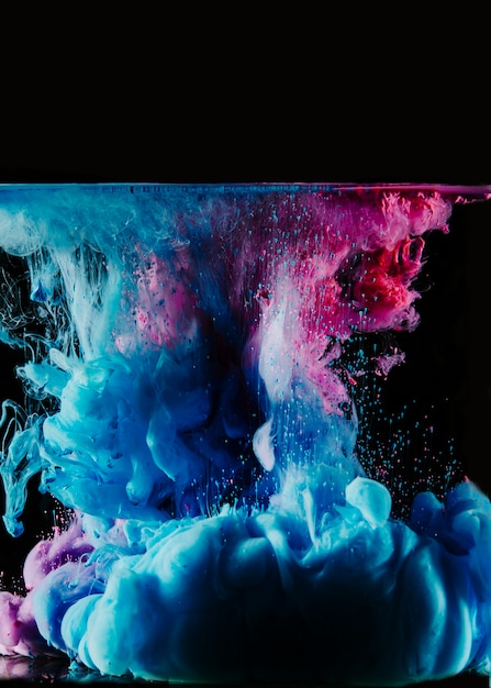 Free Photo | Blue and magenta dyes in water