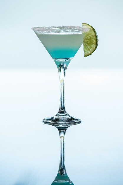 Premium Photo | Blue margarita cocktail isolated in neutral background