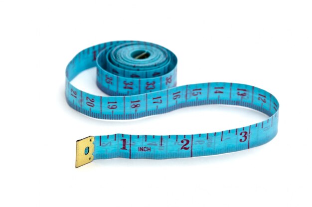 Premium Photo | Blue measuring tape isolated on white