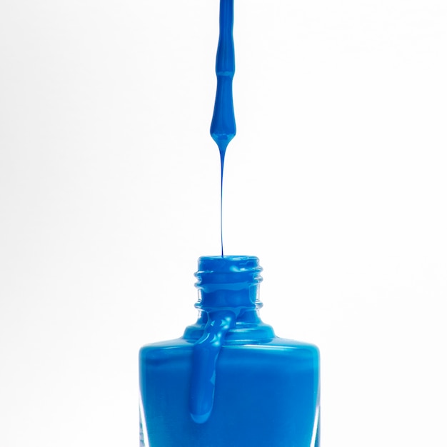 Download Free Blue Nail Polish Dripping From The Brush In Bottle On White Use our free logo maker to create a logo and build your brand. Put your logo on business cards, promotional products, or your website for brand visibility.