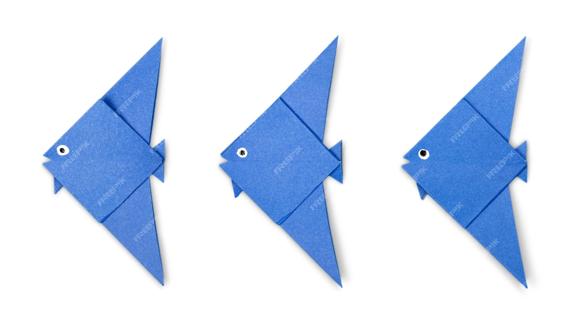 Premium Photo | Blue origami fish set isolated on white