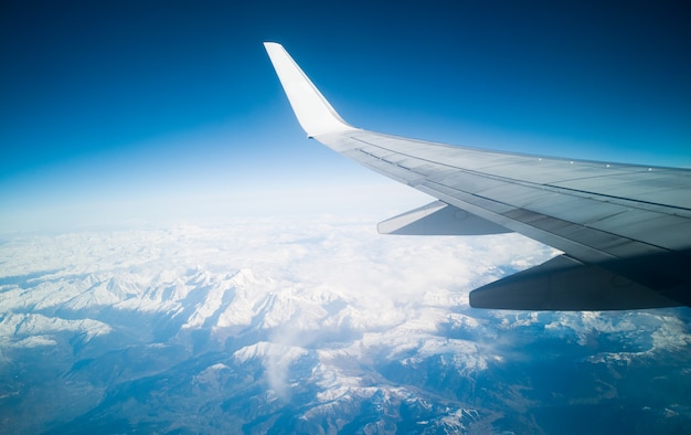 Premium Photo | Blue sky and snowed mountains view. planet earth concept