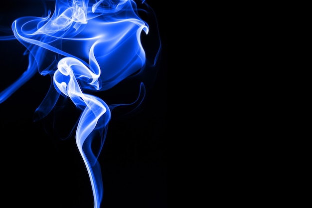 Premium Photo | Blue smoke on black background, abstract movement ...