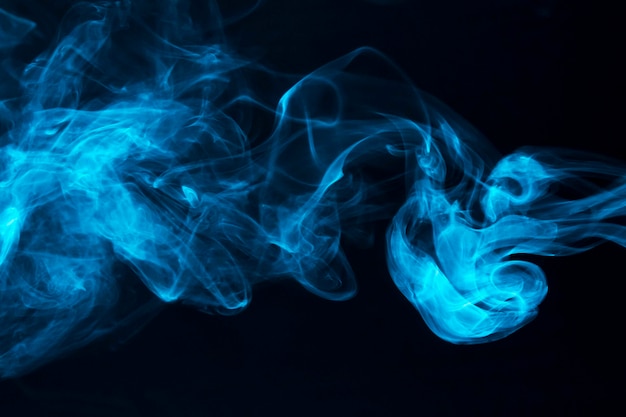 Free Photo | Blue smoke waves on black background