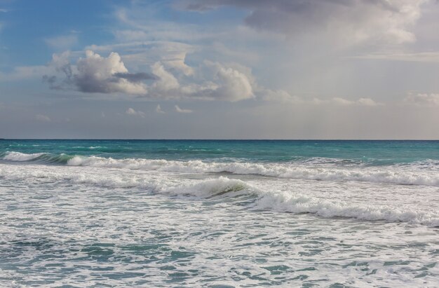 Premium Photo | Blue wave on the beach.