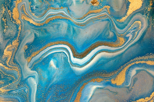 Premium Photo | Blue wave pattern with layers of gold sequins.