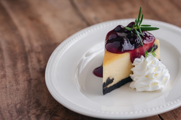 Premium Photo | Blueberry new york cheesecake with whipped cream