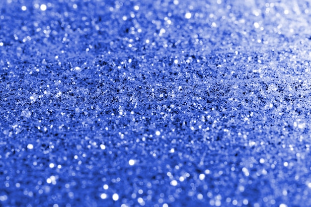 Premium Photo | Blurred blue glitter texture background