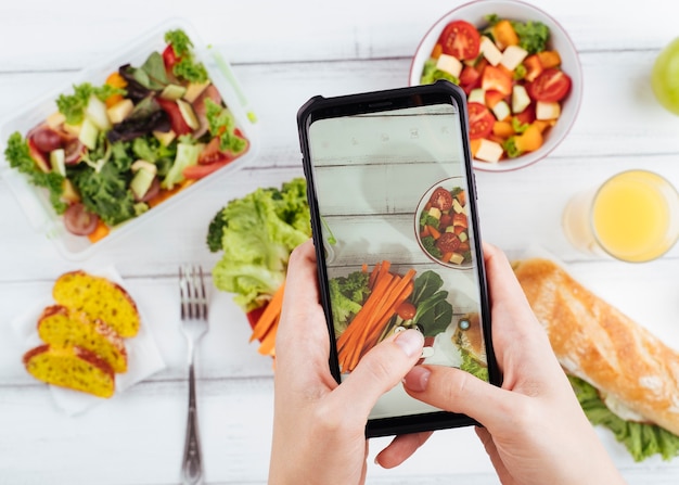 Free Photo | Blurred healthy food with phone above