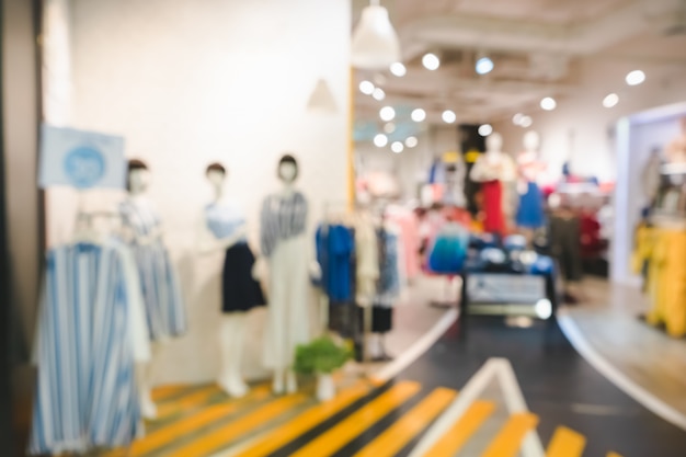 Blurred image of boutique display with mannequins in fashionable dresses for background Premium Photo
