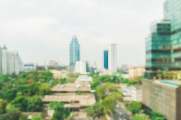 Blurred industrial city backgrounds - blur of bangkok city town with sunset and twilight sky and bokeh light view form roof top of building. blur backgrounds concept. Premium Photo