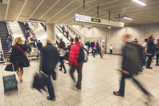 Blurred people walking inside train station Premium Photo