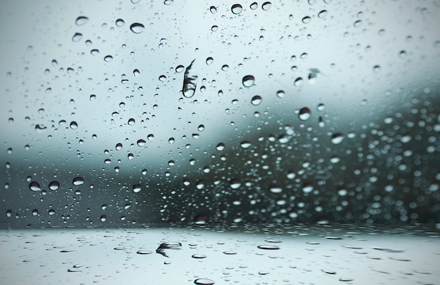 Blurred raindrop to the window Photo | Free Download