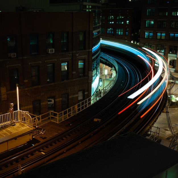 Premium Photo | Blurred Shot Of A Passenger Train Passing By At Nighttime