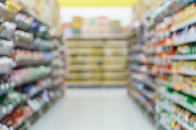 Premium Photo | Blurred supermarket snack on shelves at grocery.