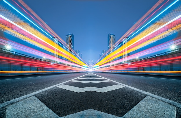 Blurred traffic light trails on road Free Photo