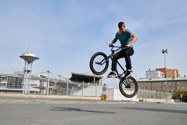 Premium Photo Bmx Rider Doing Extreme Stunts