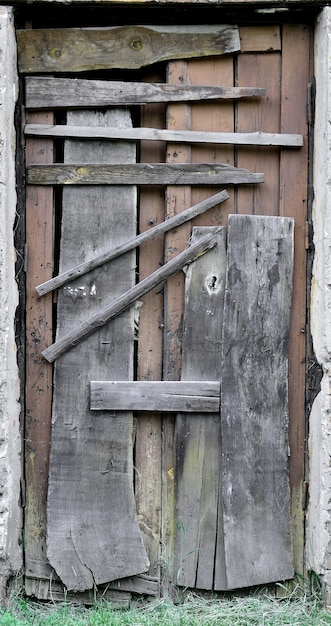 Premium Photo | Boarded up wooden door to an old abandoned house