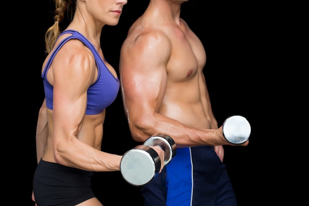 Premium Photo Bodybuilding Couple Posing With Large Dumbells   Bodybuilding Couple Posing With Large Dumbells 13339 38343 