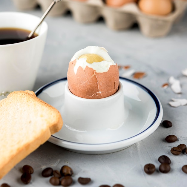 Free Photo | Boiled egg with bread and coffee beans