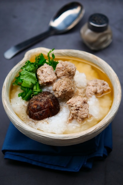 Boiled rice with minced pork, shiitake mushrooms Premium Photo