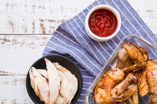 Free Photo | Boiled and roasted chicken wings with tomato sauce over