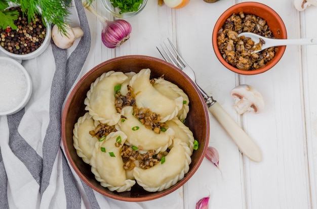 Premium Photo | Boiled vegan dumplings (vareniki) with potatoes and ...