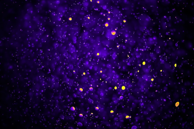 Bokeh abstract background with violet purple color and yellow dot bubble Premium Photo